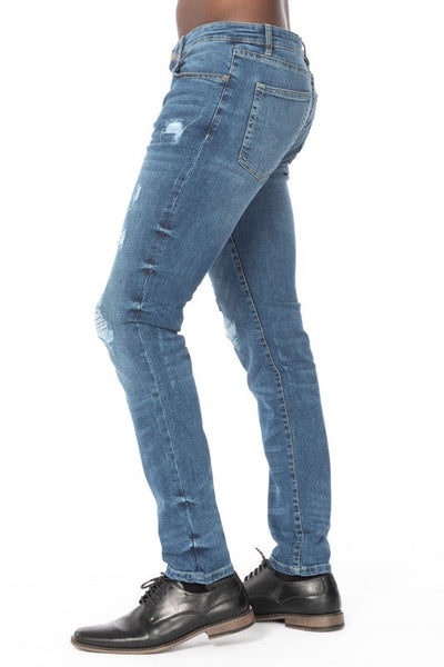 DISTRESSED RIP SLIM TAPER DENIM JEANS